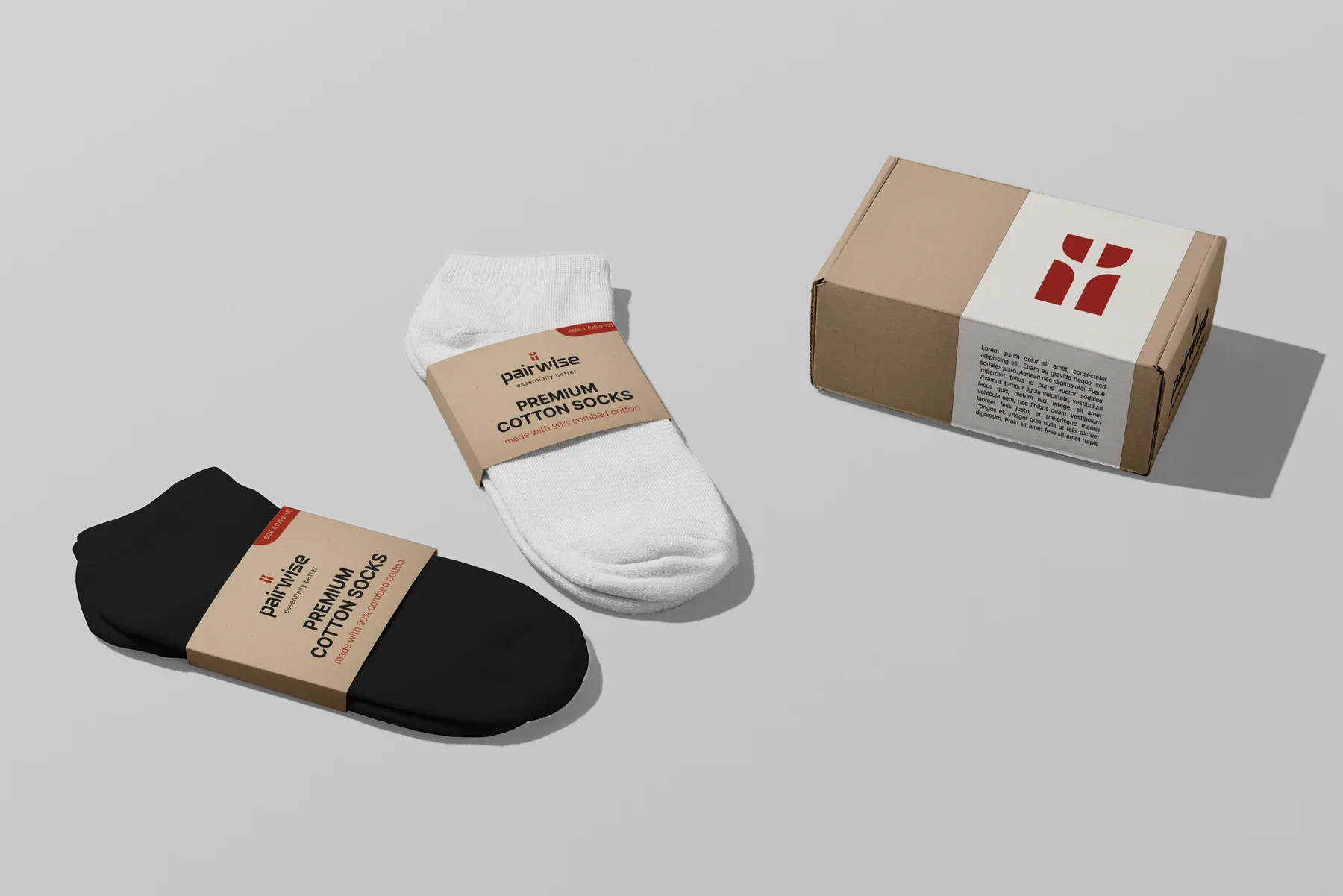 Black and white socks in kraft sleeves next to the closed shipping box